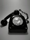 A vintage and antique telephone with white background.